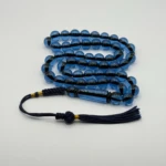 مسبحة باكالايت أزرق شفاف فخمة – 51 حبّة – 10 مم – كركوشة سوداء و ذهبي