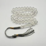 مسبحة باكالايت شفافة – 51 حبّة – 10 مم مع كركوشة رمادي و ذهبي