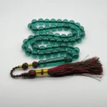 مسبحة باكالايت أخضر شفاف فخمه – 51 حبّة – 10 مم مع طربوش أحمر و ذهبي