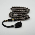 مسبحة باكالايت شفافة سوداء فاخرة – 51 حبّة – 10 مم – كركوشة سوداء وذهبي